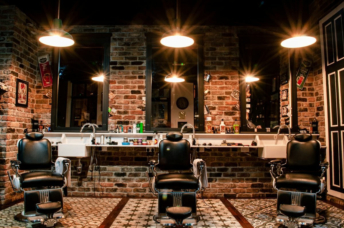 A classic barbershop with leather chairs and warm lighting